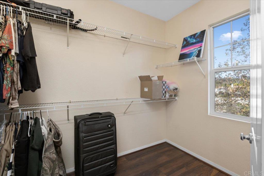 4163 Lake Cir Drive Fallbrook, CA 92028 - Photo 25 of 34 a view of walk in closet with clothes and shoes
