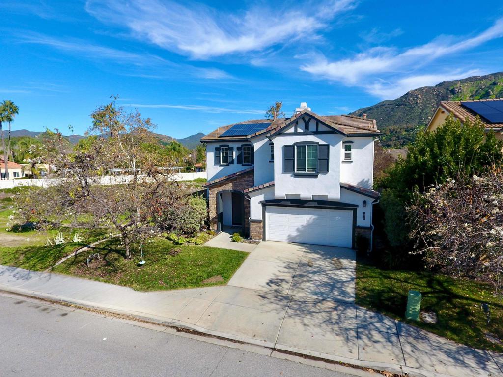 4163 Lake Cir Drive Fallbrook, CA 92028 - Photo 31 of 34 a front view of a house with a yard