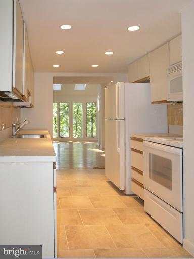 1646 Waters Edge Lane Reston, VA 20190 - Photo 11 of 30 a kitchen with a sink stove and refrigerator