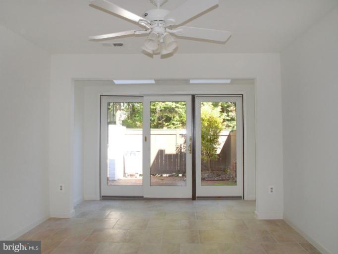 1646 Waters Edge Lane Reston, VA 20190 - Photo 15 of 30 an empty room with windows and outdoor view