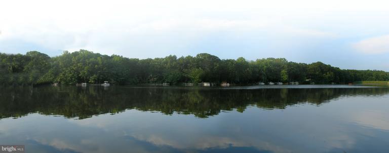 1646 Waters Edge Lane Reston, VA 20190 - Photo 23 of 30 a view of a lake with a mountain in the background
