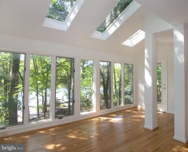 1646 Waters Edge Lane Reston, VA 20190 - Photo 24 of 30 a view of a big room with wooden floor and windows
