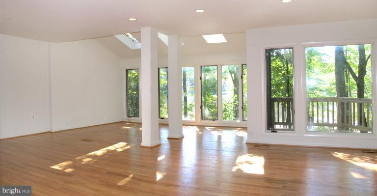 1646 Waters Edge Lane Reston, VA 20190 - Photo 10 of 30 a view of an empty room with wooden floor and a window