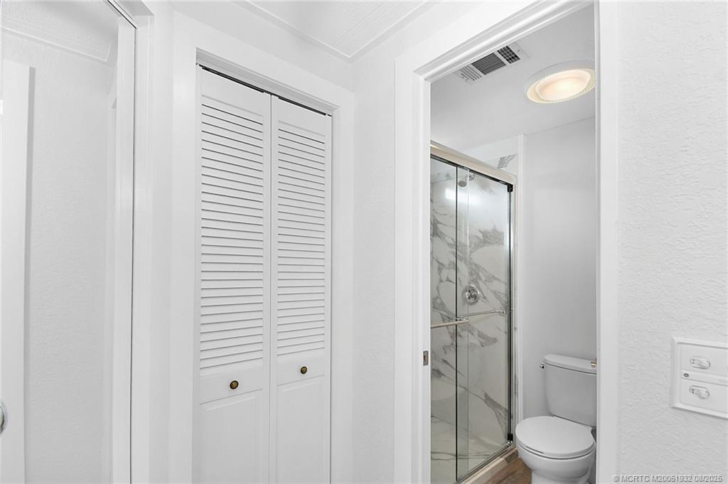 2800 Southwest Toronado Trail Stuart, FL 34997 - Photo 18 of 32 Private bath area & linen closet