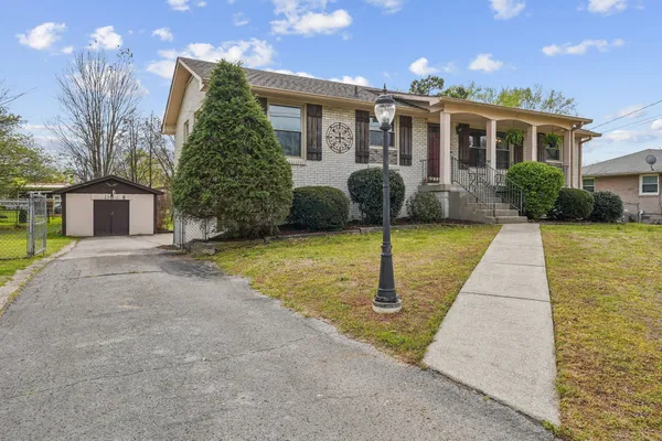 a front view of a house with garden