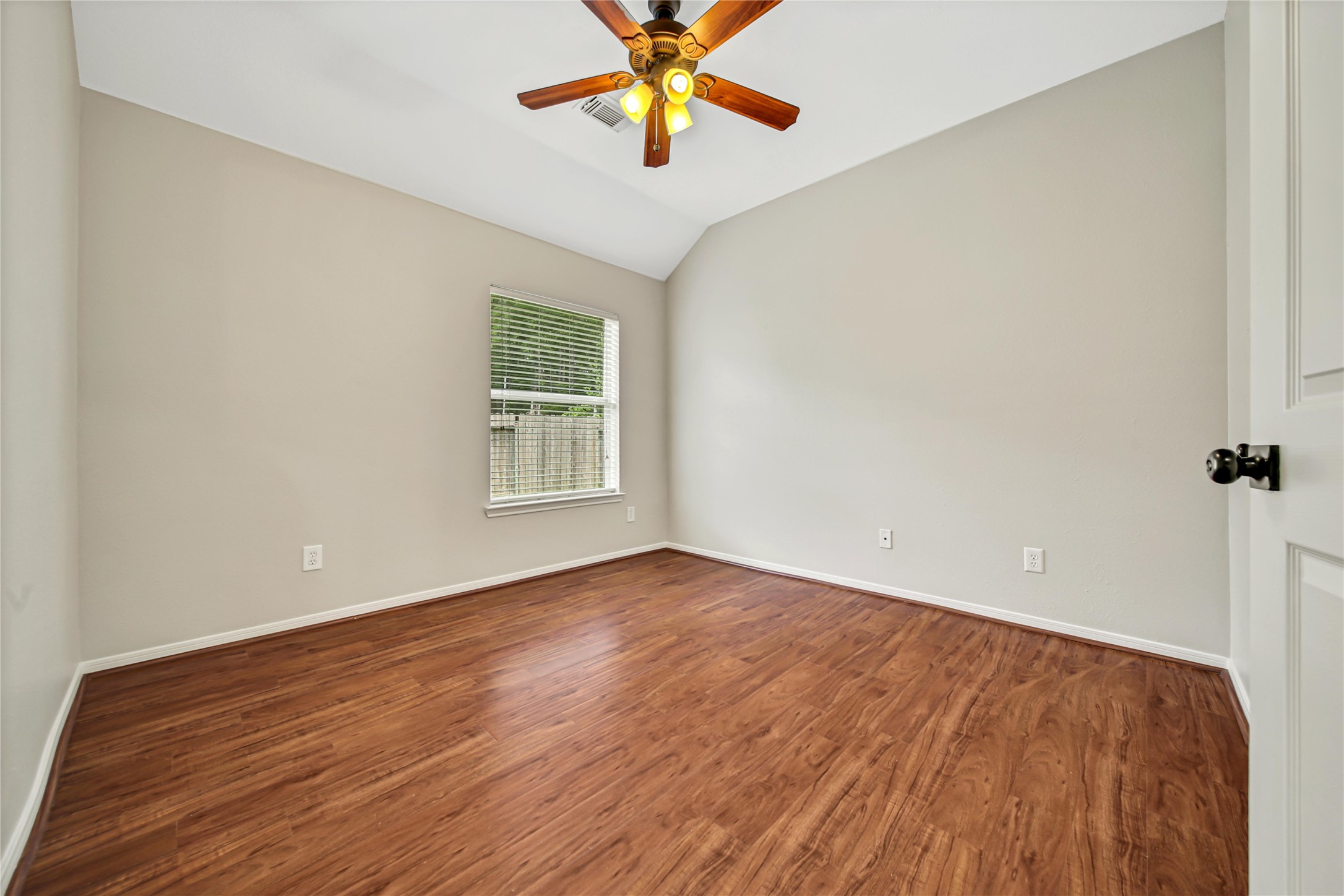 14526 Red Tailed Hawk Lane Houston, TX 77044 - Photo 30 of 40 wooden floor in an empty room with a window