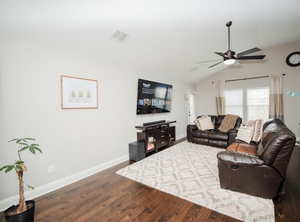 18125 Justice Lane Dallas, TX 75287 - Photo 15 of 18 a living room with furniture and a flat screen tv