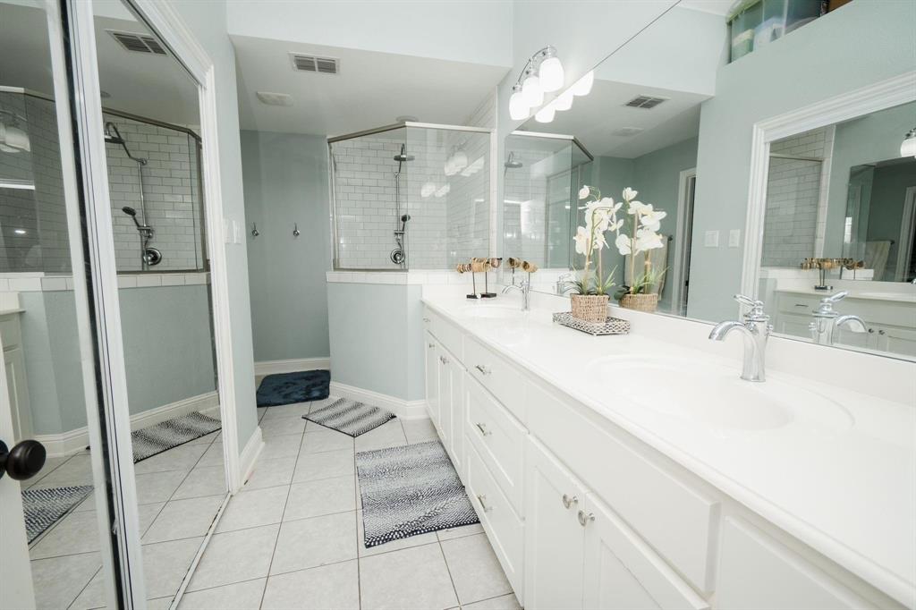 18125 Justice Lane Dallas, TX 75287 - Photo 3 of 18 a spacious bathroom with a double vanity sink mirror and shower