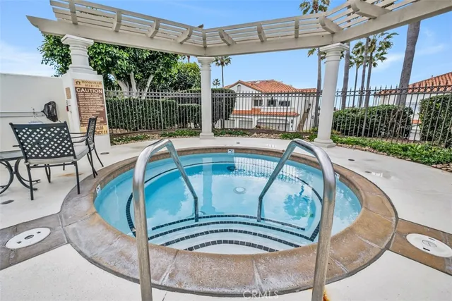 an aerial view of residential houses with outdoor space and river view