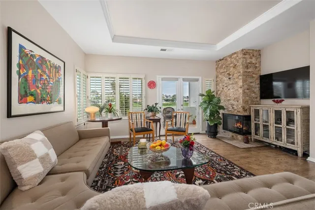 a living room with furniture kitchen and a window