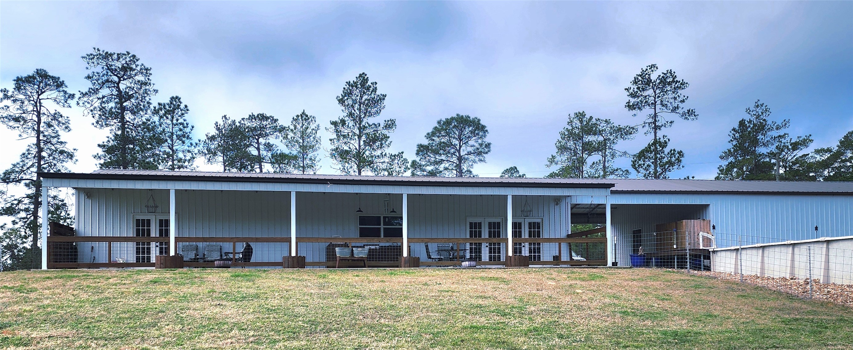 a view of a house with a yard and sitting area