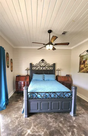 a room with a bed and cabinets