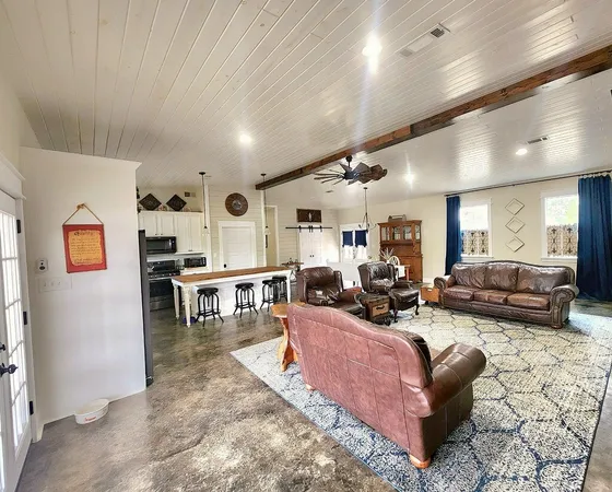 a living room with furniture and a couch