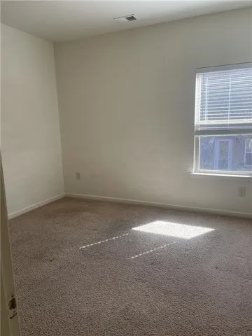 a view of a room that has a window in it