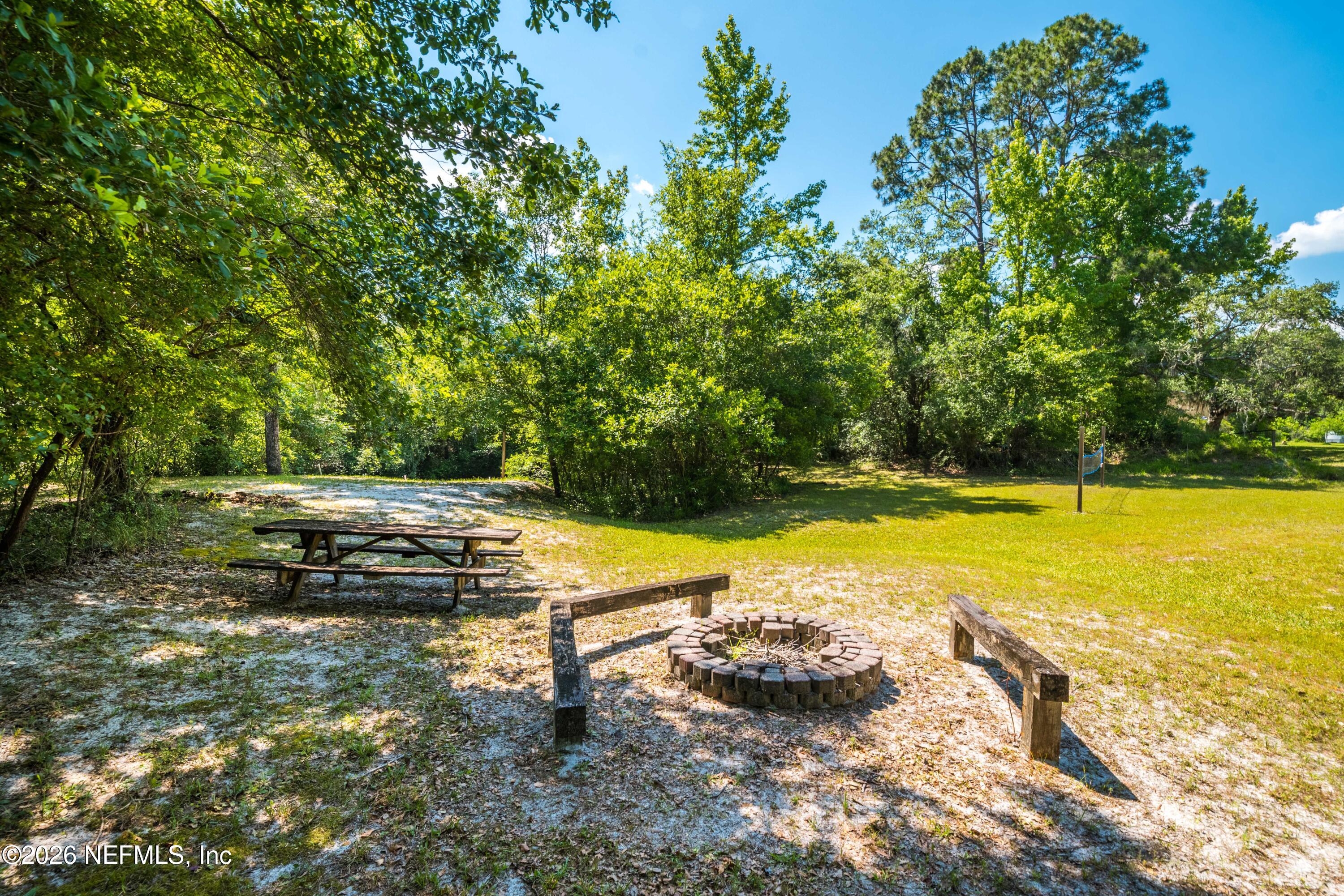 4369 Hawk Haven Road Middleburg, FL 32068 - Photo 14 of 17 a view of a swimming pool with a yard