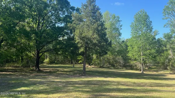 a view of a house with a big yard