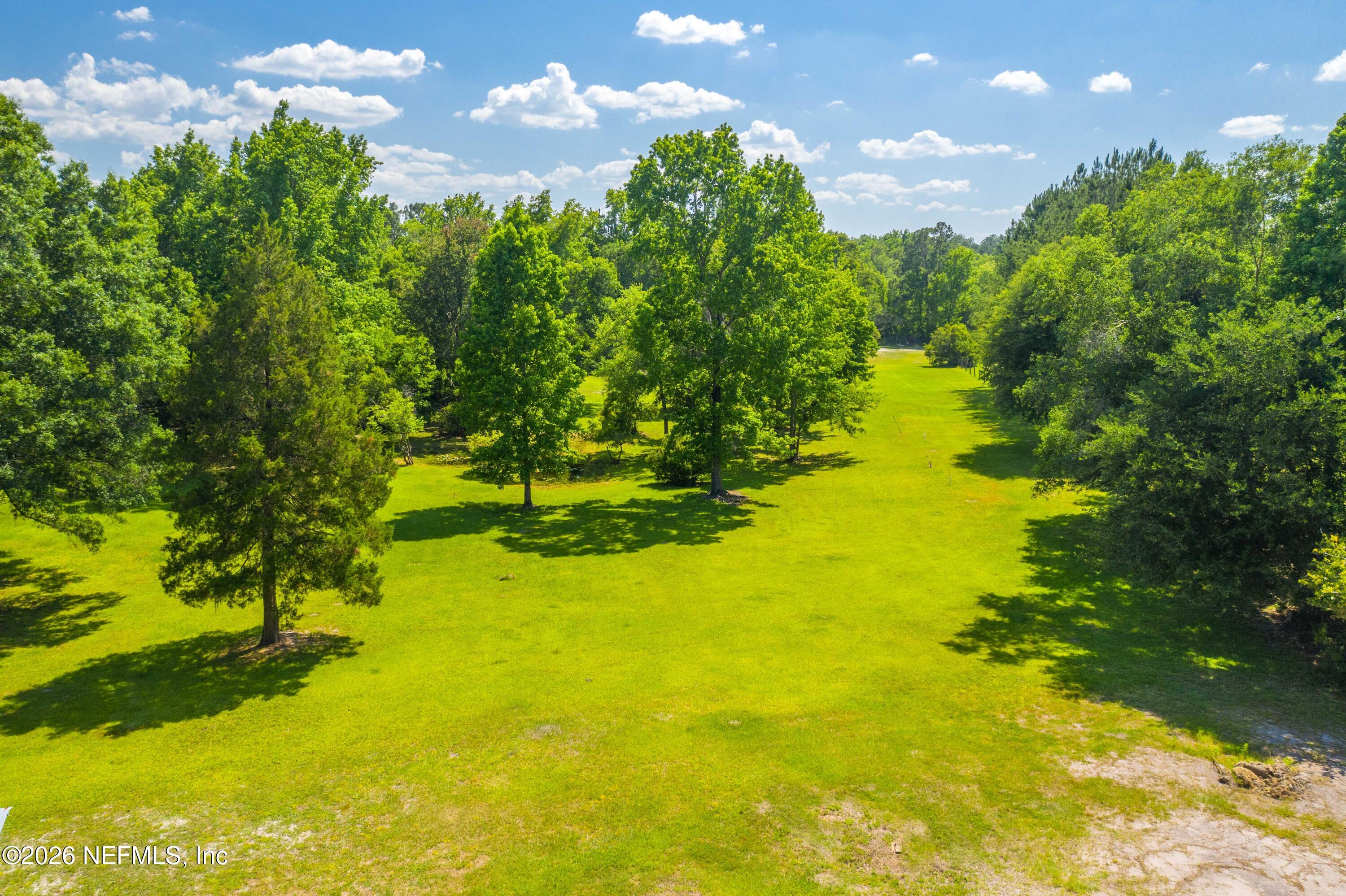 4369 Hawk Haven Road Middleburg, FL 32068 - Photo 8 of 17 a view of a lake with a yard