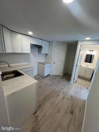 a view of a kitchen with washer and dryer