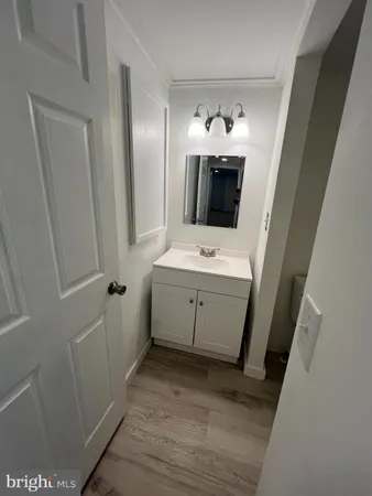a view of a bathroom with a sink and mirror