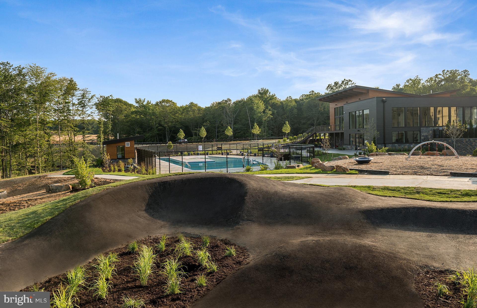 236 Mainstream Drive Laurel, MD 20724 - Photo 22 of 30 a view of a lake with a house in the background