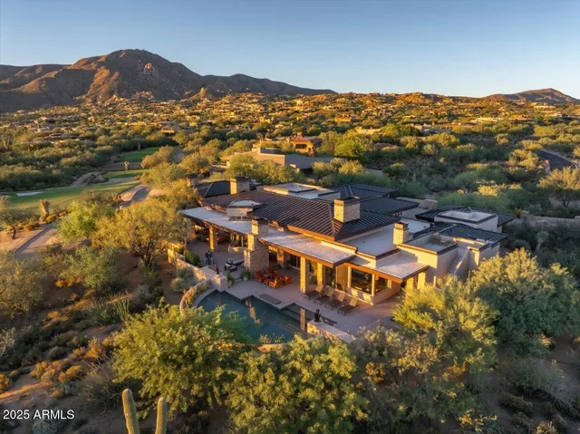 a view of a city with mountains in the background