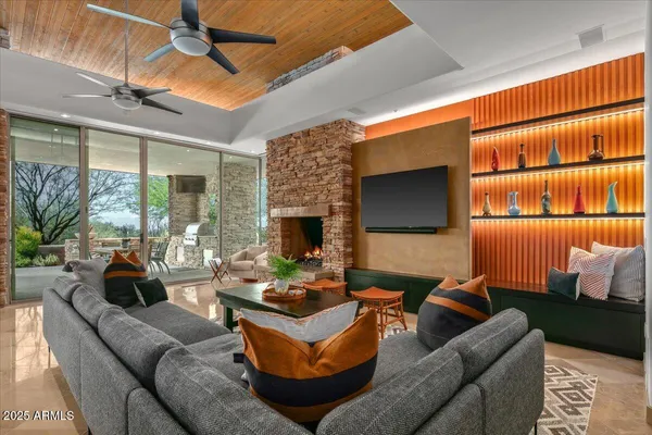 a living room with furniture and a large window