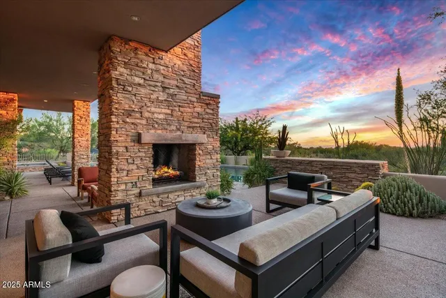 a outdoor space with patio fireplace and couches