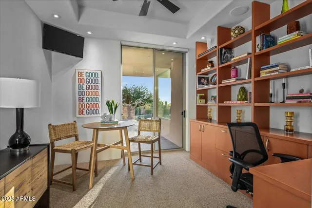 a view of backyard with plants and outdoor seating