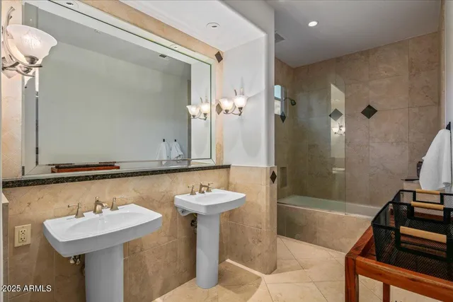 an aerial view of a house with yard and mountain view in back