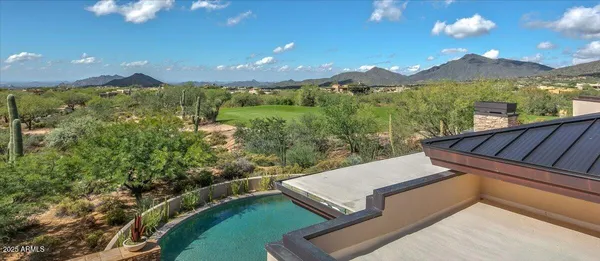 a outdoor living space with furniture and a fireplace