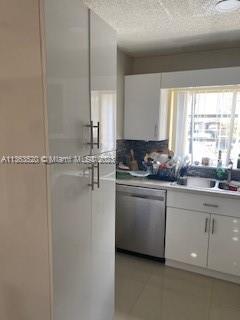 1025 West 77th Street, Unit N Hialeah, FL 33014 - Photo 12 of 30 a kitchen with a refrigerator and window