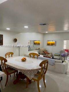 1025 West 77th Street, Unit N Hialeah, FL 33014 - Photo 13 of 30 a view of a dining room with furniture and window