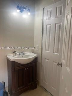 1025 West 77th Street, Unit N Hialeah, FL 33014 - Photo 21 of 30 a bathroom with a sink and a mirror