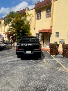 1025 West 77th Street, Unit N Hialeah, FL 33014 - Photo 4 of 30 a car parked in front of a house
