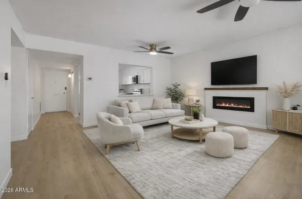 a living room with furniture and a fireplace
