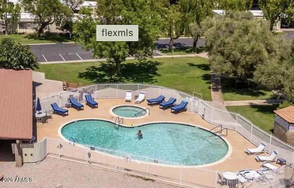 a view of a swimming pool with a yard