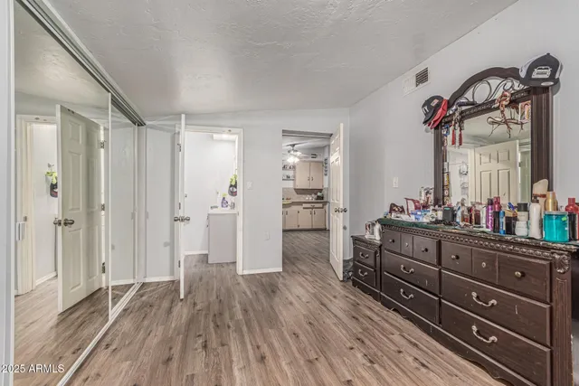 a bathroom with a shower a sink and toilet