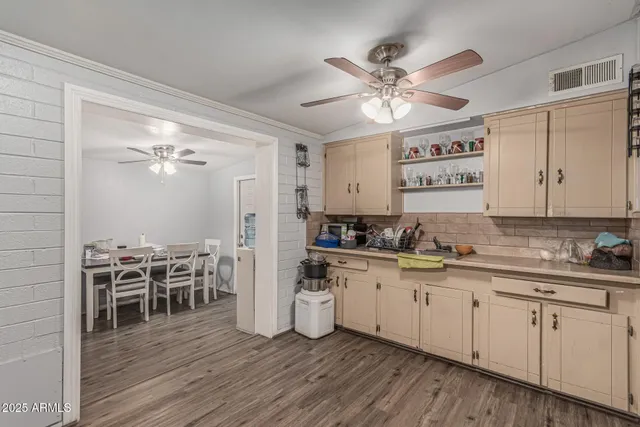 a kitchen with stainless steel appliances a refrigerator sink and stove