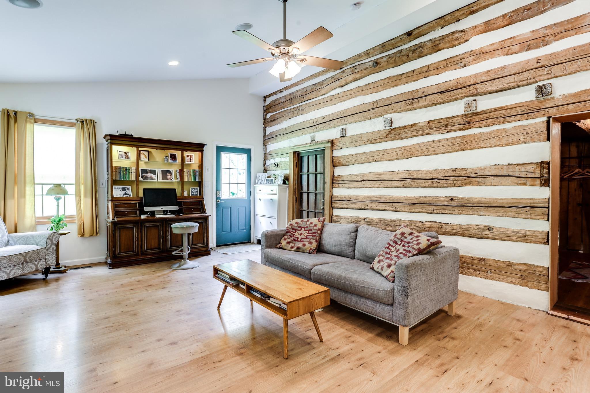 828 Warren Road Cockeysville, MD 21030 - Photo 20 of 30 Family Room with Log Walls
