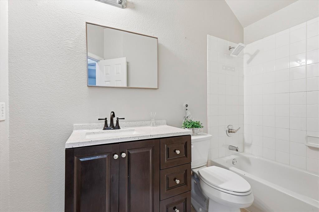 2147 Hunt Club Trail Frisco, TX 75033 - Photo 24 of 27 a bathroom with a granite countertop sink toilet and shower