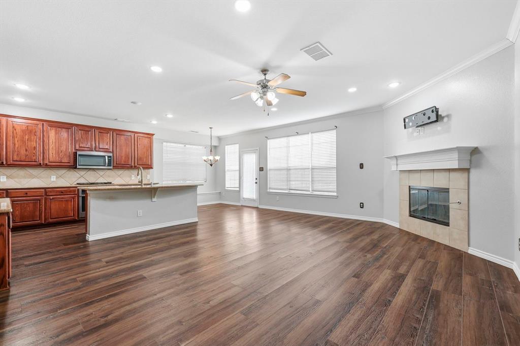 2147 Hunt Club Trail Frisco, TX 75033 - Photo 8 of 27 a view of a kitchen with a sink a kitchen counter top space and stainless steel appliances