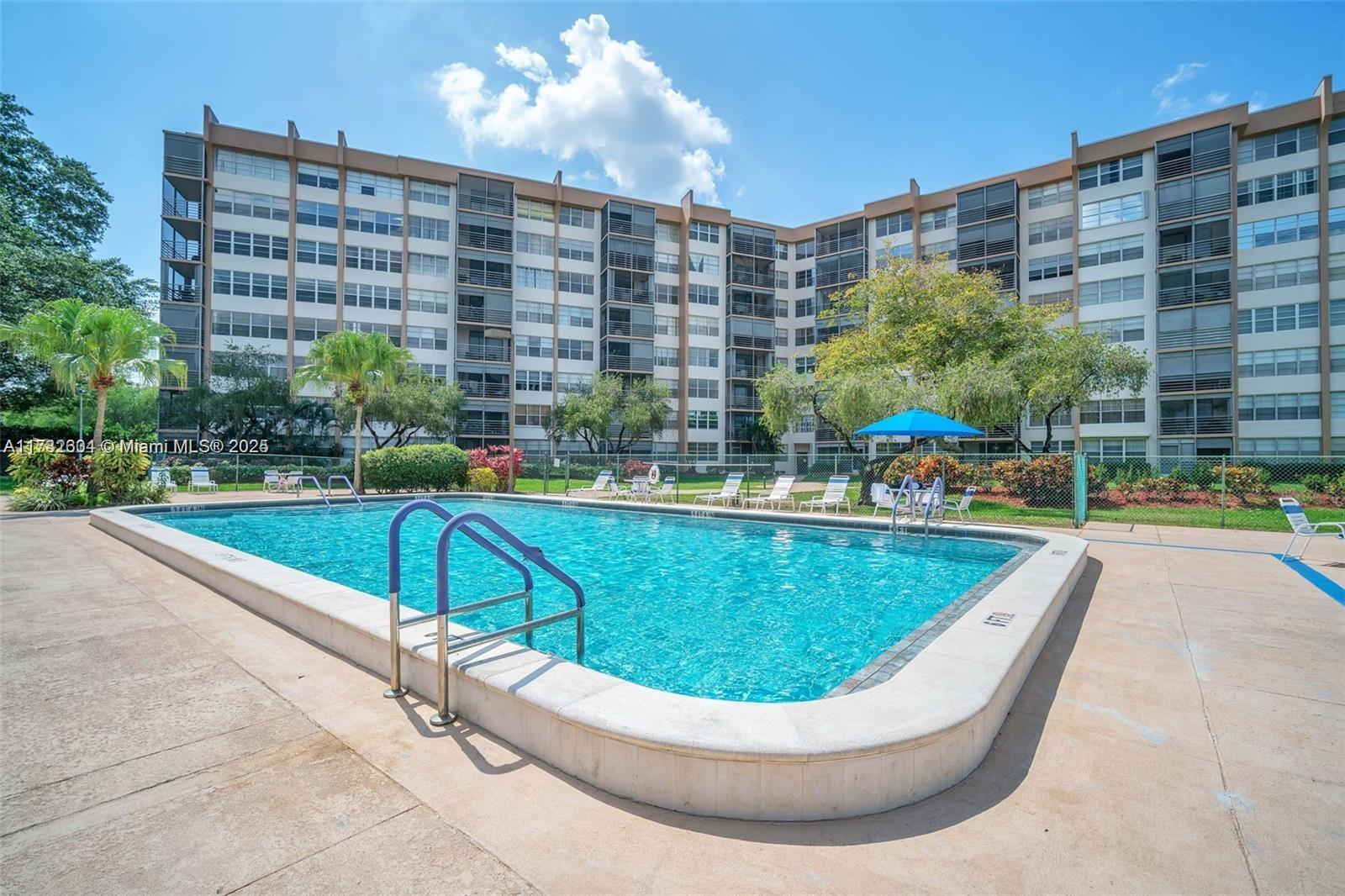 1200 St Charles Place, Unit 419 Pembroke Pines, FL 33026 - Photo 14 of 16 a view of a swimming pool with a patio