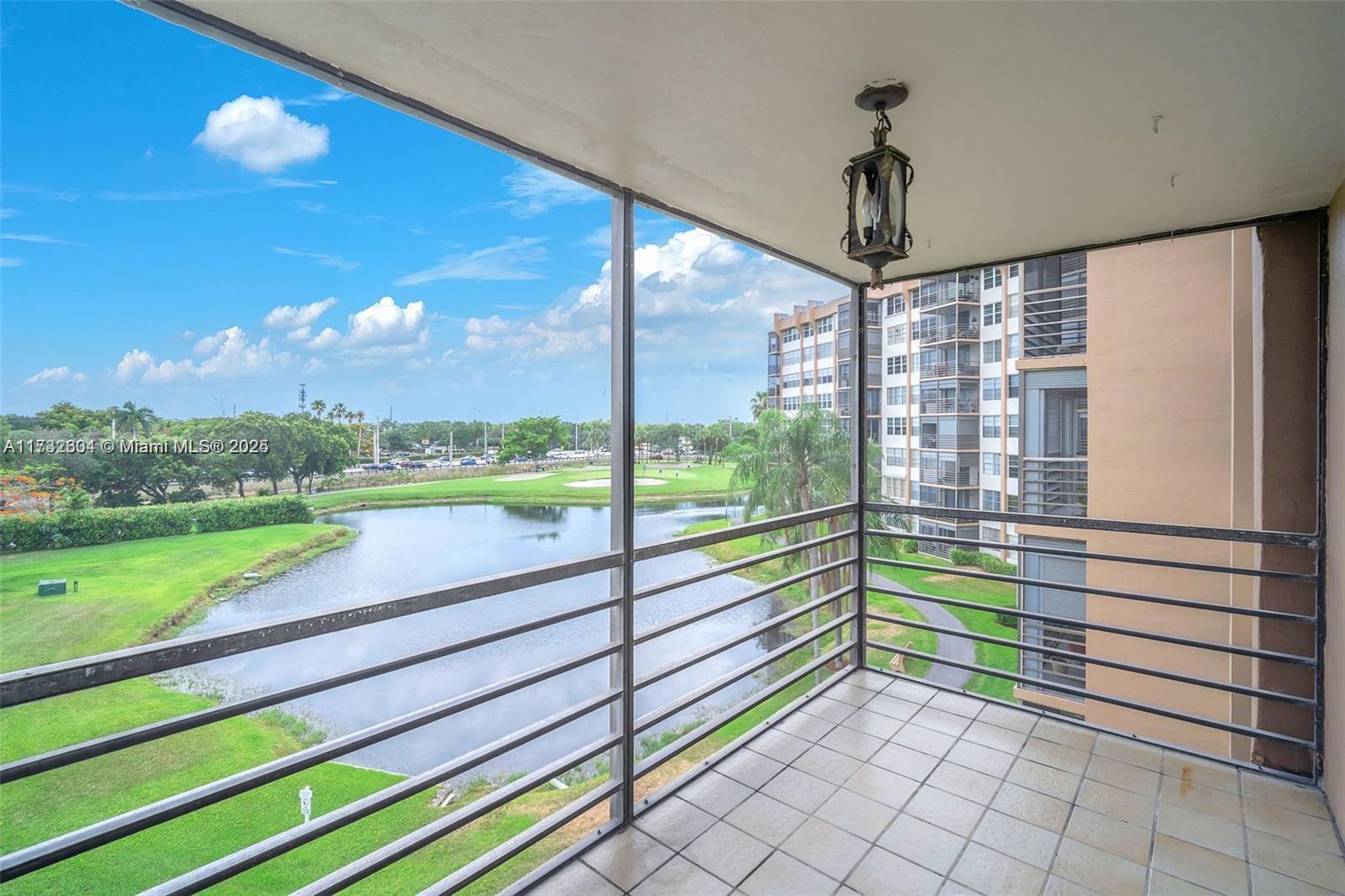 1200 St Charles Place, Unit 419 Pembroke Pines, FL 33026 - Photo 5 of 16 a view of a back yard from a balcony