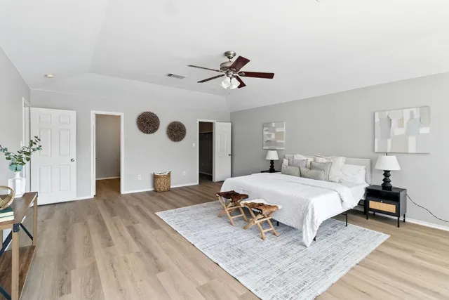 a view of an empty room with a fireplace and a window
