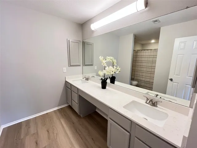 a bed room with a bed and a large window