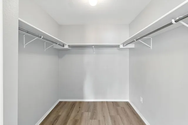 a bathroom with a toilet and a shower curtain