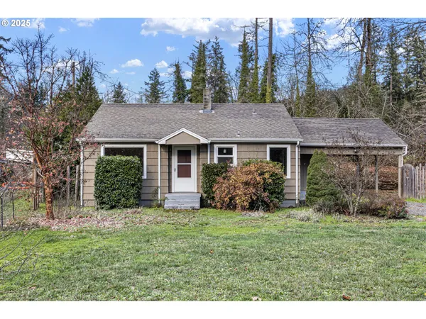 a view of a house with garden and yard