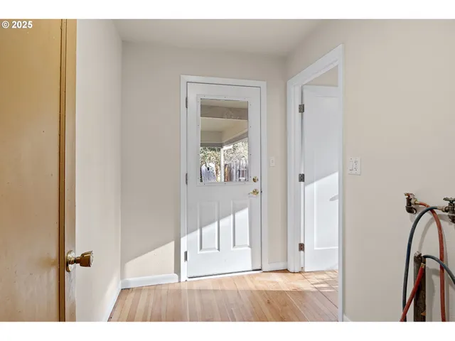 a view of a bathroom with wooden floor