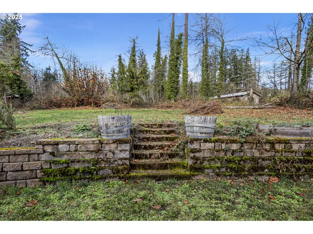 a house with lots of trees in the background