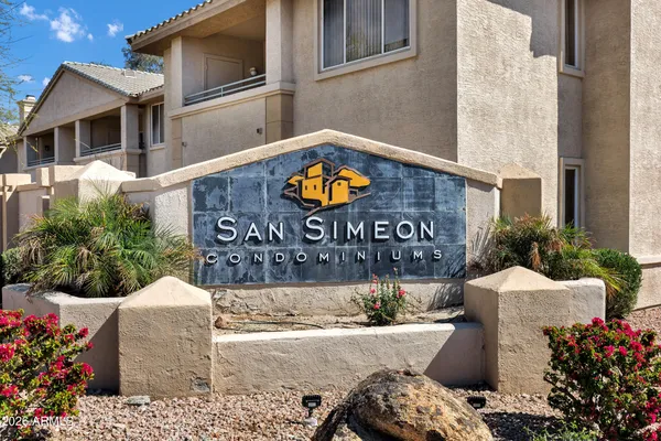 a view of a pathway of a house with wooden stairs